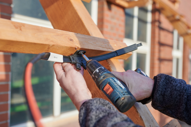 Installation of solar roof tiles in close-up