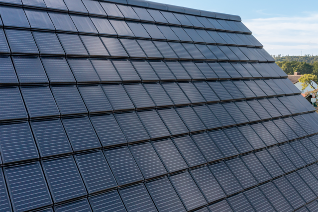Close-up of a roof covered with Stylist-PV solar roof tiles in elegant black