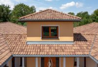 Mediterranean style bungalow with Roman pan Marko Bella Casa with tile details.