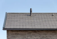 Inspiringly beautiful clinker brick house with flat bricks in noble slate laid in a row with picture focus on the gable