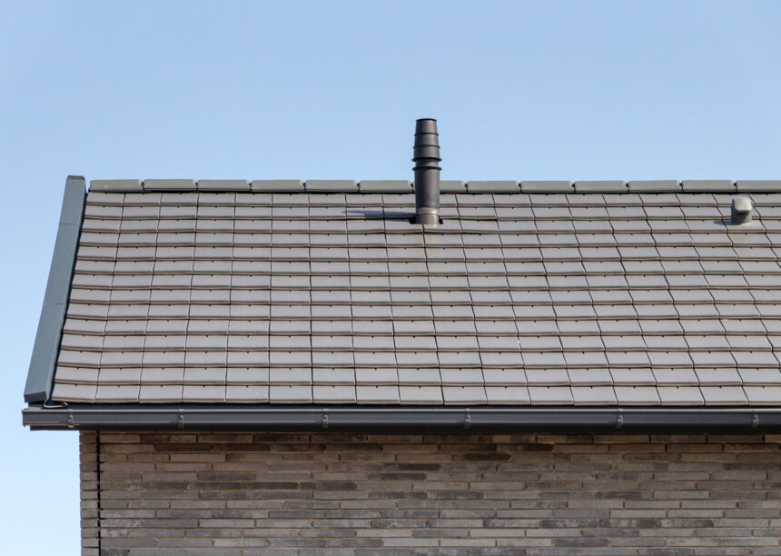 Inspiringly beautiful clinker brick house with flat bricks in noble slate laid in a row with picture focus on the gable