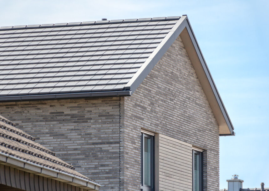 Inspiringly beautiful clinker brick house with flat bricks in noble slate laid in a row with picture focus on the gable