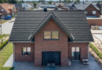 Great clinker brick house with Z7v reform tiles on a pitched roof with large dormers