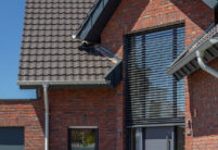 Great clinker brick house with Z7v reform tiles on a pitched roof with large dormers