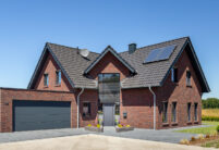 Great clinker brick house with Z7v reform tiles on a pitched roof with large dormers